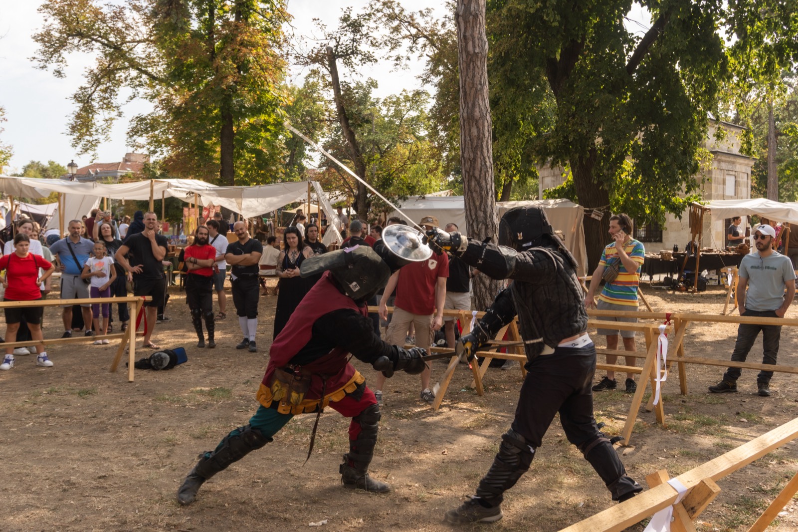 Two competitors fencing on the festival ground at the Sharp Plum Tournament